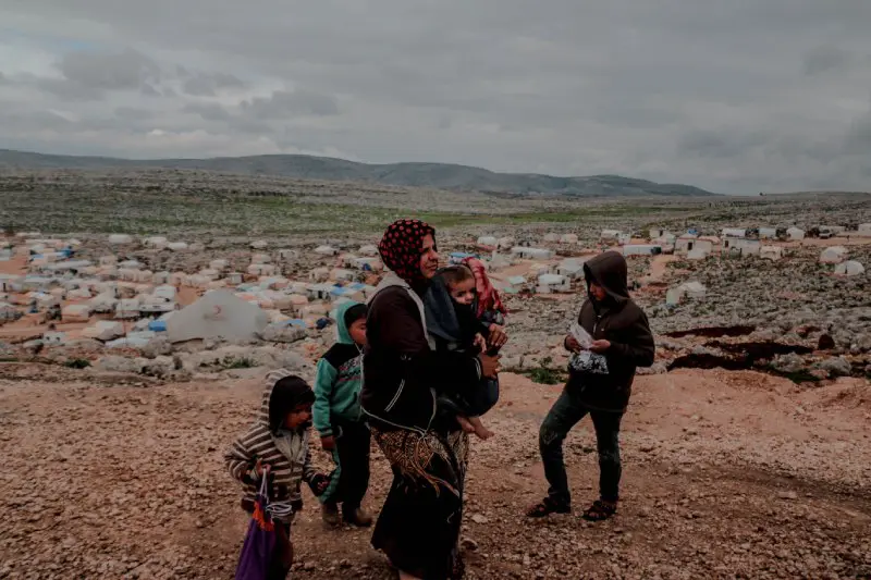 Woman with Family in the Camp for Displaced Persons